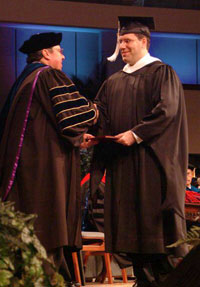 Kevin accepts his sheepskin